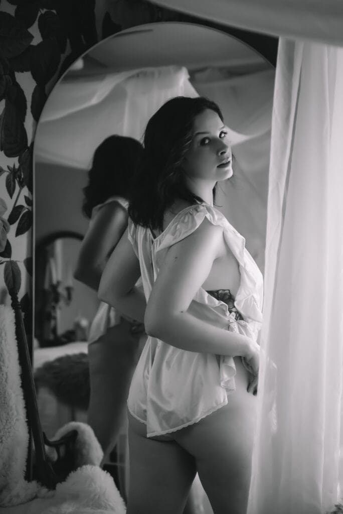 Artistic boudoir session shot with warm tones reflecting self-love presence greenville south carolina