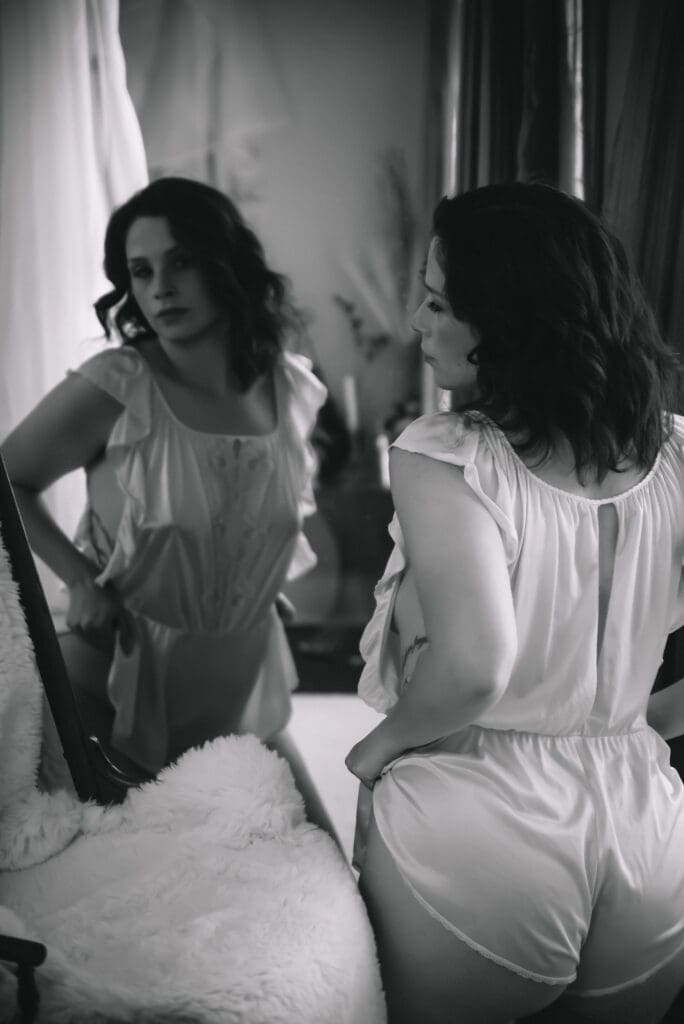 Elegant boudoir image emphasizing natural curves and serene pose greenville