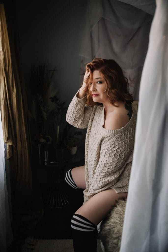 Boudoir image showing relaxed pose with gentle lighting capturing inner strength greenville sc