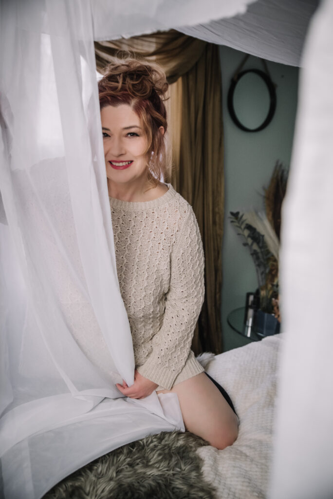 Boudoir image showing relaxed pose with gentle lighting capturing inner strength greenville