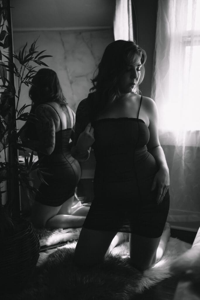 Elegant boudoir image emphasizing natural curves and serene pose columbia