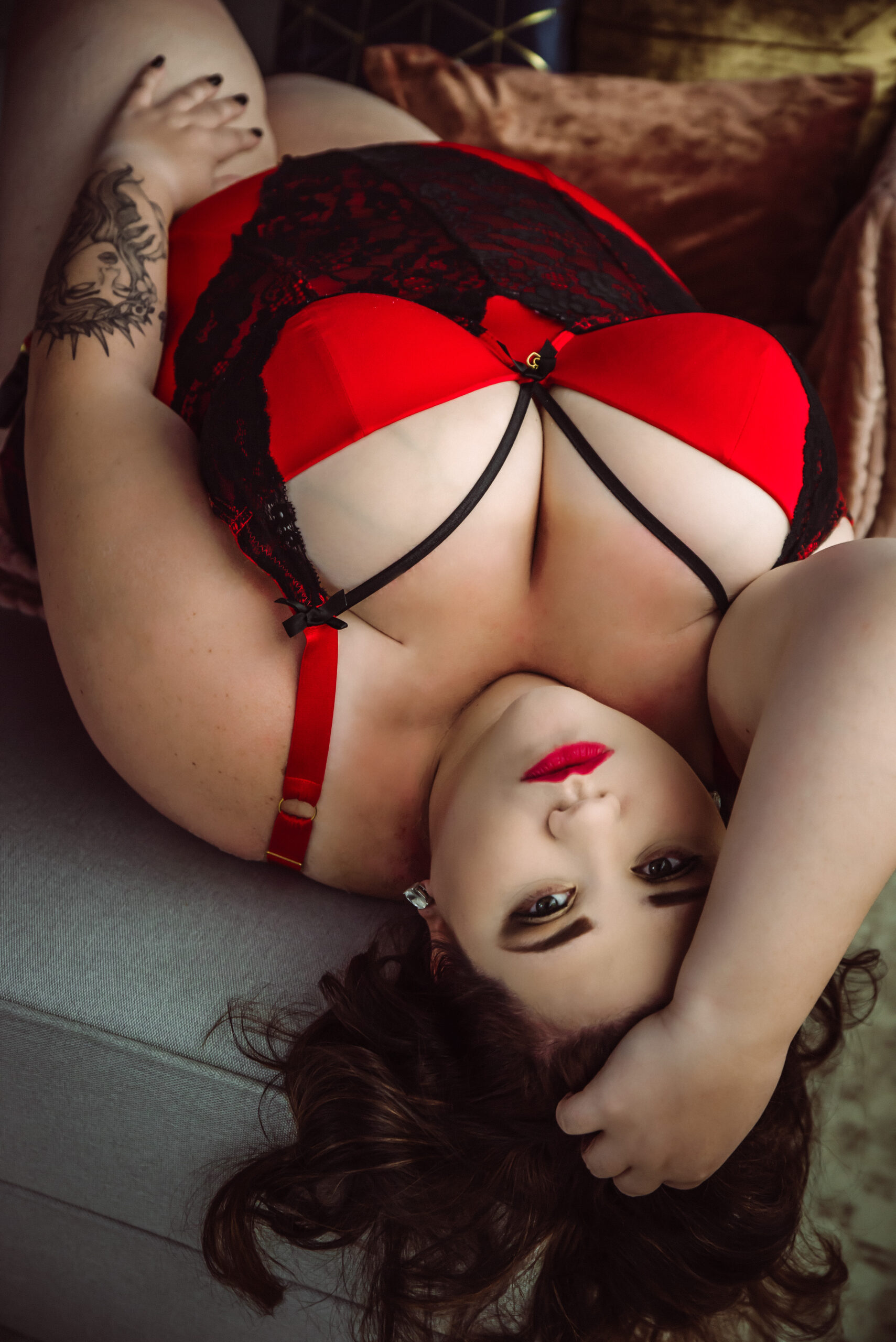 a woman poses boldly in a newberry boudoir photoshoot