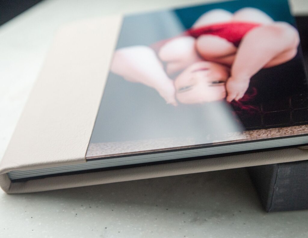 a boudoir photo album with a shining acrylic cover