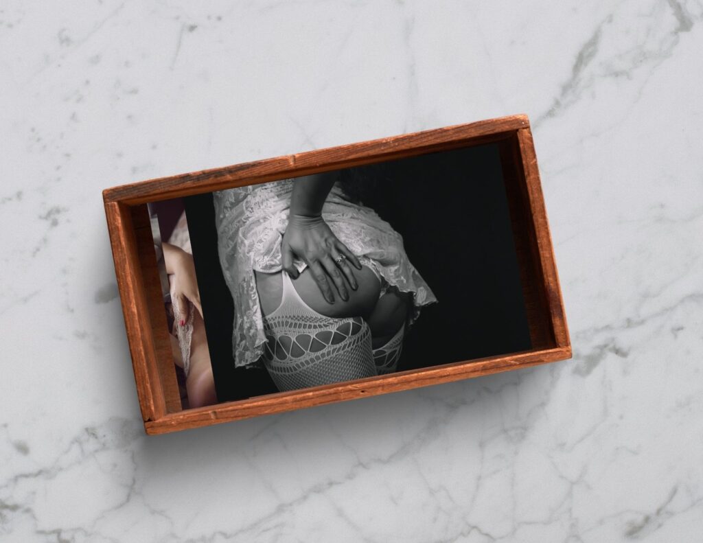 boudoir photos are presented in a wooden keepsake box